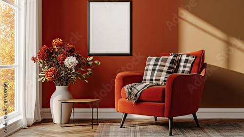 A cozy living room with a red armchair, a black frame, and a vase of flowers.