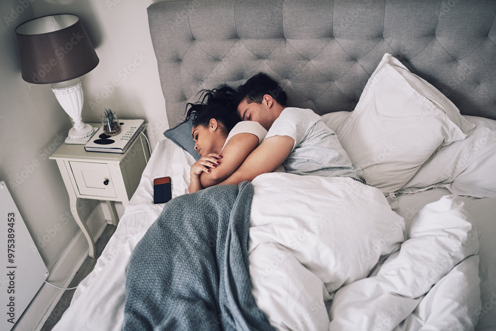 Couple, sleeping and cuddle on bed in home for resting, security and comfortable nap on weekend. People, hug and dreaming in bedroom for relax, break and relationship with blankets, bonding and love