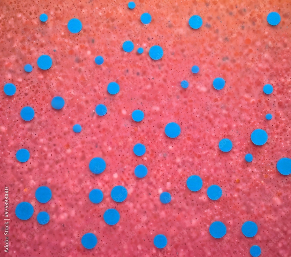 a close-up view of a pinkish-red surface with numerous small blue circles scattered across it, creating a visually striking pattern. a close-up view of a pinkish-red surface with numerous small blue circles scattered across it, creating a visually striking pattern.