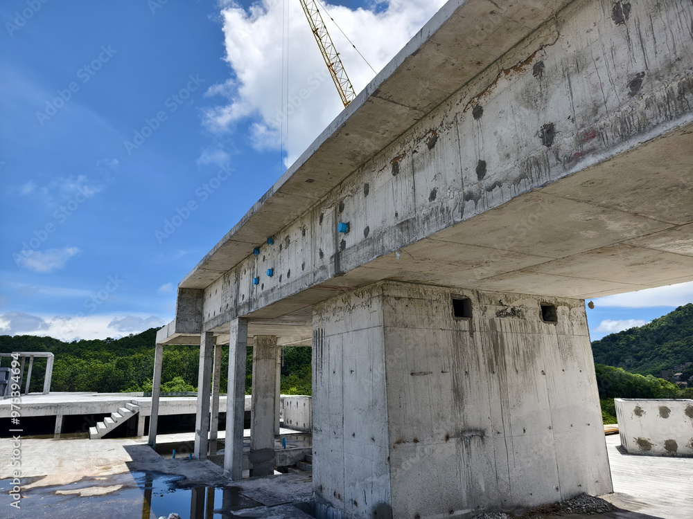 Large building with a roof pool of water under construction Large building with a roof pool of water under construction