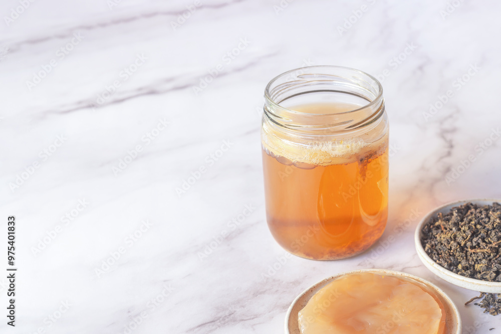 kombucha starter in a glass jar bottle with healthy Kombucha SCOBY kombucha starter in a glass jar bottle with healthy Kombucha SCOBY