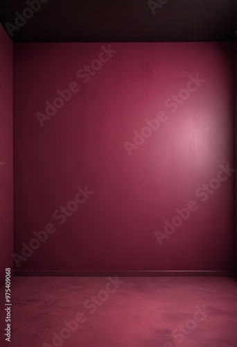 A dark red wall with a single light source on the right side, creating a dramatic contrast.