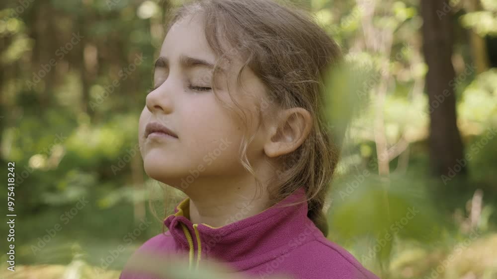Portrait Child Girl Exhaling Fresh Air, Taking Deep Breath, Reducing Stress in Forest. Dreamy peaceful relaxed smiling kid girl breathing fresh air nature, tranquil caucasian child alone outdoors. Portrait Child Girl Exhaling Fresh Air, Taking Deep Breath, Reducing Stress in Forest. Dreamy peaceful relaxed smiling kid girl breathing fresh air nature, tranquil caucasian child alone outdoors.