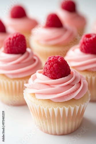 Cupcakes with pink frosting and fresh berry