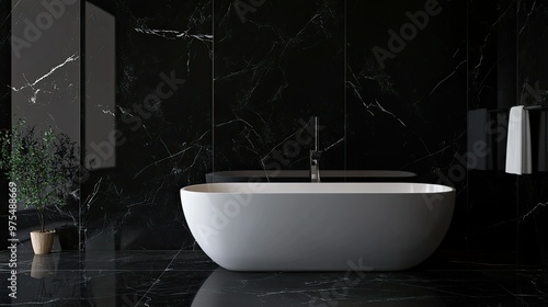 Modern bathroom with black marble tiles, a white bathtub, and a plant in a pot.