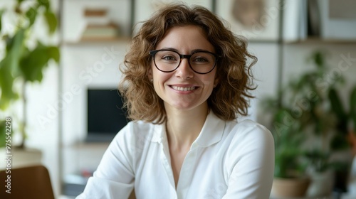 Confident Smiling Psychologist in Her Workspace with Professional Attire and Relaxed Ambiance