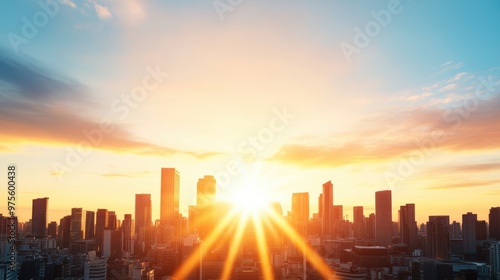 A panoramic view of a city skyline bathed in the warm, golden glow of a setting sun.