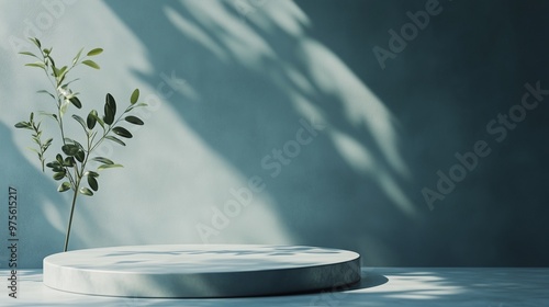 Minimalist podium stage concrete textured blue wall with shadow light and decoration plant photo