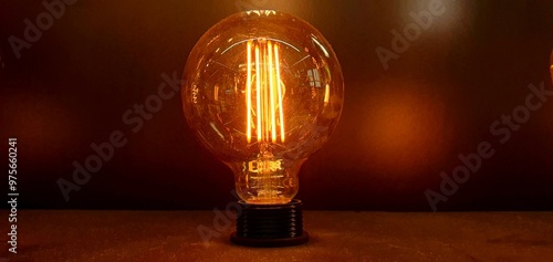 Decorative LED incandescent light bulb close-up. Modern rope chandelier. Vintage and retro lamp bulb. Filament LED lamp. Modern night light. Decorative flickering LED lighting.