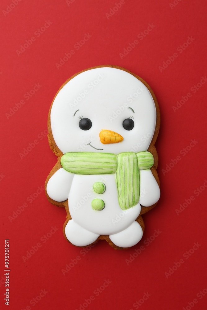 Tasty Christmas cookie in shape of snowman on red background, top view Tasty Christmas cookie in shape of snowman on red background, top view