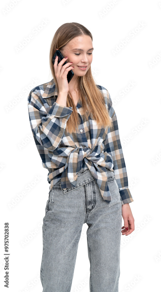Young woman wearing a checkered shirt and jeans, talking on a smartphone. Isolated on a white background. Concept of communication and casual fashion Young woman wearing a checkered shirt and jeans, talking on a smartphone. Isolated on a white background. Concept of communication and casual fashion