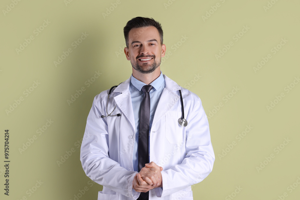 Smiling doctor with stethoscope on olive background Smiling doctor with stethoscope on olive background