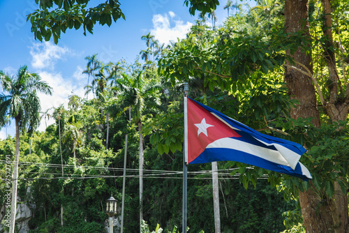 Cuban flag waving in Vinales Valley, Pinar del Rio photo