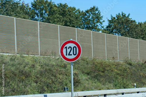 Sign 120 on the motorway. Speed limit road sign. photo