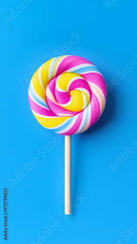 Bright swirled lollipop isolated on a blue background