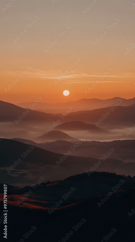 Fototapeta premium Sunrise Over Mountain Range with Fog