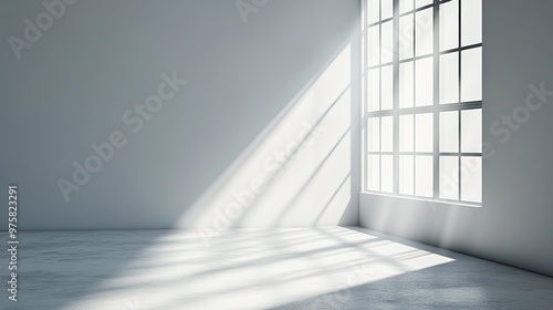 A room with a large window that is letting in a lot of light