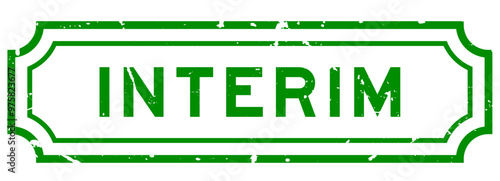 Grunge green interim word rubber seal stamp on white background