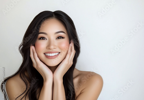  Beautiful Young Asian Woman with Clean, Healthy Skin on a White Background 