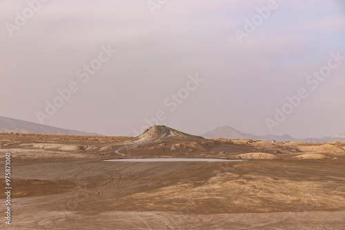 A round boiling lake of a mud volcano near the village of Alyat. Azerbaijan.