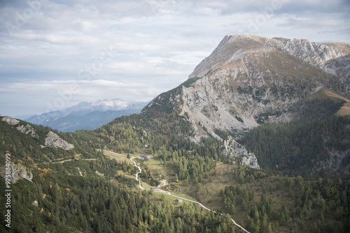 Rocky mountain summit with road leading through forest on its foot, Germany photo