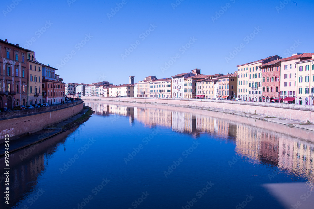 Pisa's iconic blend of history and art, reflected in the gentle flow of the Arno river Pisa's iconic blend of history and art, reflected in the gentle flow of the Arno river