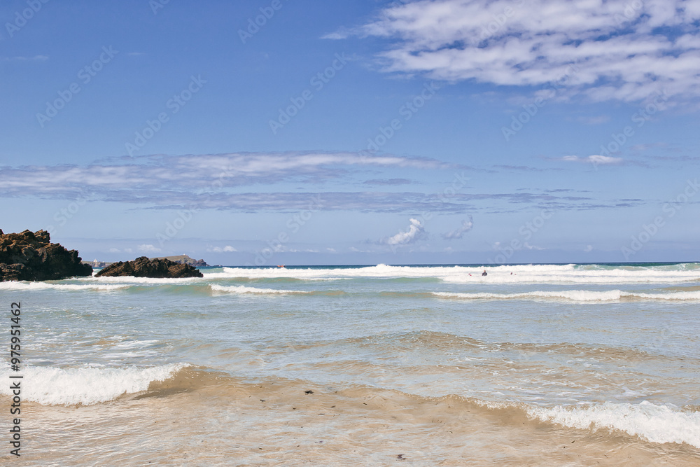 Serene Beach with Gentle Waves and Clear Sky at Mawgan Porth Beach, Newquay, Cornwall Serene Beach with Gentle Waves and Clear Sky at Mawgan Porth Beach, Newquay, Cornwall
