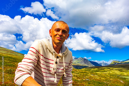 Young hiker and mountains landscape panorama Rondane National Park Norway. photo