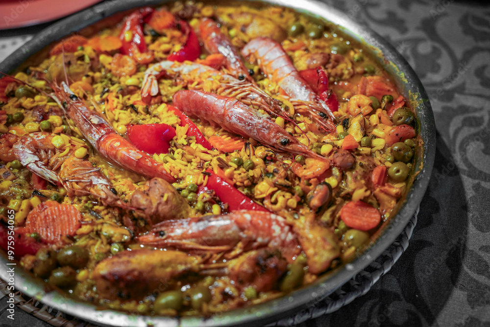 Typical spanish dish paella with rice and shrimps