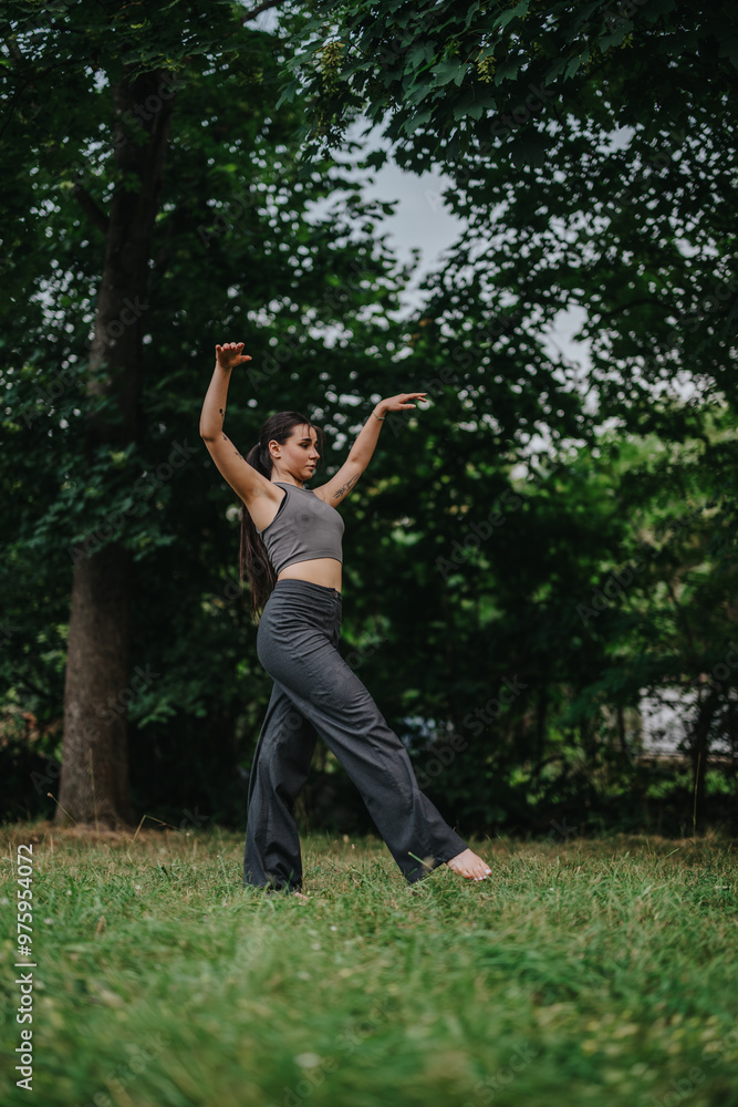 A woman practicing yoga in a tranquil forest setting, demonstrating balance and concentration. Surrounded by lush greenery, she embodies peace and mindfulness. A woman practicing yoga in a tranquil forest setting, demonstrating balance and concentration. Surrounded by lush greenery, she embodies peace and mindfulness.