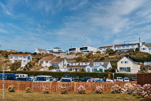 Hillside Residential Area with Colorful Flowers at Mawgan Porth Beach, Newquay, Cornwall photo