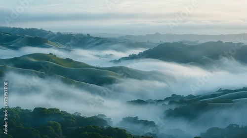 Rolling Hills and Mist Swirling Through a Mountainous Landscape