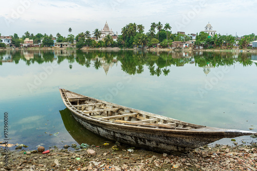 Obraz na płótnie Traditional Bengali Wooden boat on pond bank Shiva Temple, at Puthia Rajbari complex, in Puthia, Bangladesh. Pancha Ratna Shiva Temple. w salonie