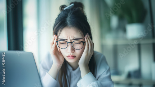 Young woman with aching eyes after working on computer