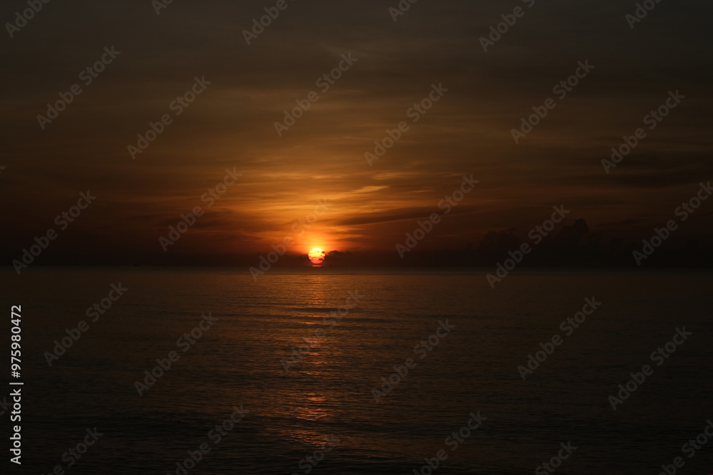 The sun rises at the sea in the morning. The sun rises at the sea in the morning.