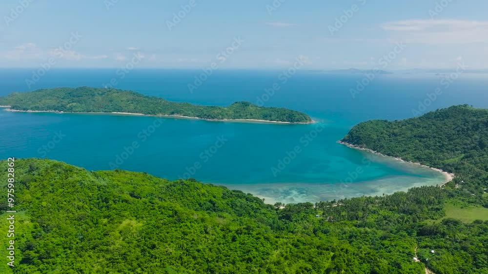 Aerial view of green plants in tropical island with beach in El Nido, Palawan. Philippines. Aerial view of green plants in tropical island with beach in El Nido, Palawan. Philippines.