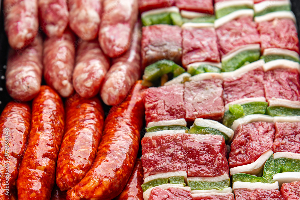 raw sausage meat assorted juicy pork, beef fresh gourmet food background on the table rustick food top view copy space raw sausage meat assorted juicy pork, beef fresh gourmet food background on the table rustick food top view copy space