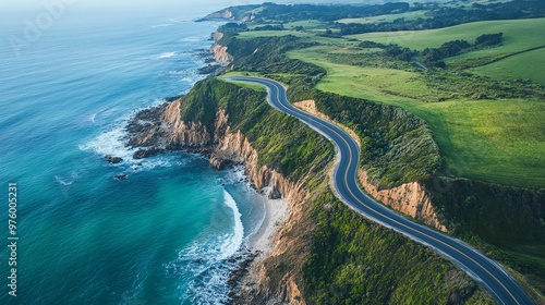 Winding Coastal Road with Lush Green Hills and Deep Blue Ocean