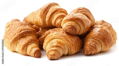 A pile of six golden brown croissants isolated on a white background.