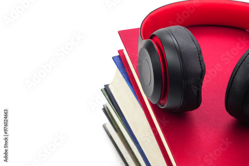 The headphones are on stack of books. Modern education and relaxation concept.