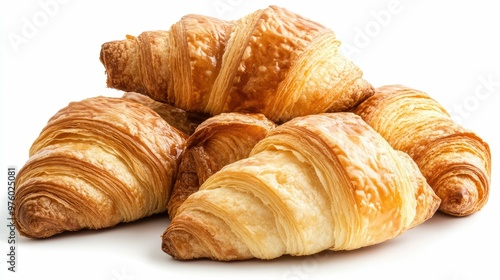 A stack of four golden brown croissants isolated on a white background.