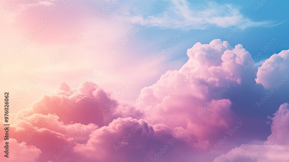 A vibrant, colorful sky with fluffy white clouds illuminated by the warm glow of the setting sun. The sky is a mix of pink, blue, and orange hues, creating a beautiful and dreamy atmosphere. A vibrant, colorful sky with fluffy white clouds illuminated by the warm glow of the setting sun. The sky is a mix of pink, blue, and orange hues, creating a beautiful and dreamy atmosphere.