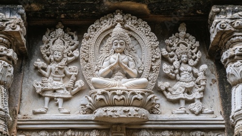 A serene Buddha statue sits in meditation, surrounded by a detailed bronze halo, set against a textured teal and gold background.