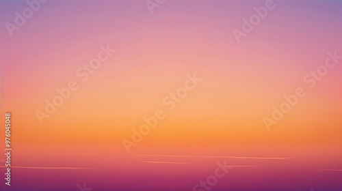 Gradient sunset sky with shades of orange, pink, and purple blending smoothly across the horizon. 