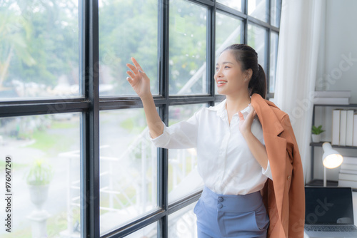 Free Download portrait of beautiful young Asian business woman standing while smiling looking at camera in the office - GFXLoad