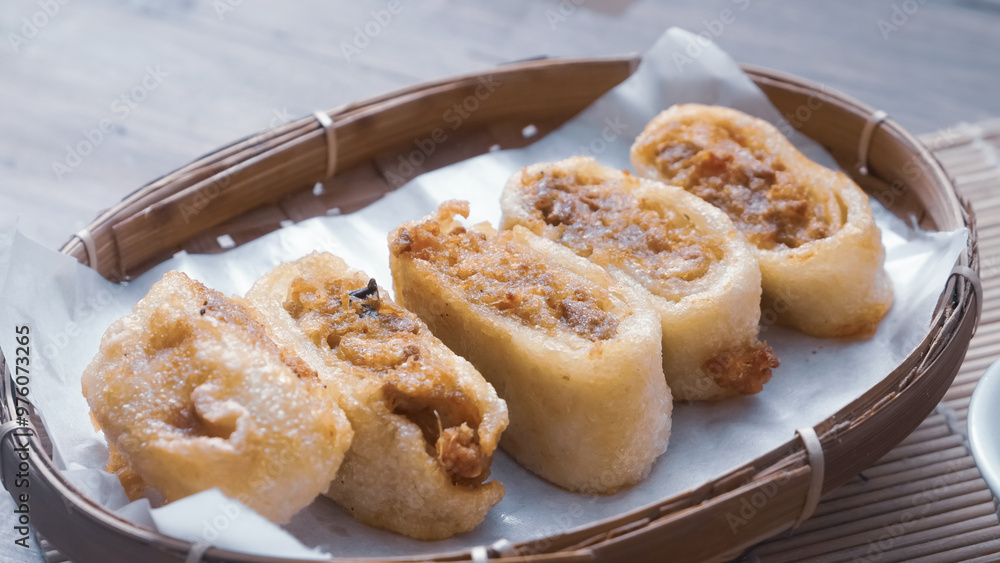 Gohyong is typical chinesse food served with sliced chilies and cuko sauce. Gohyong is typical chinesse food served with sliced chilies and cuko sauce.