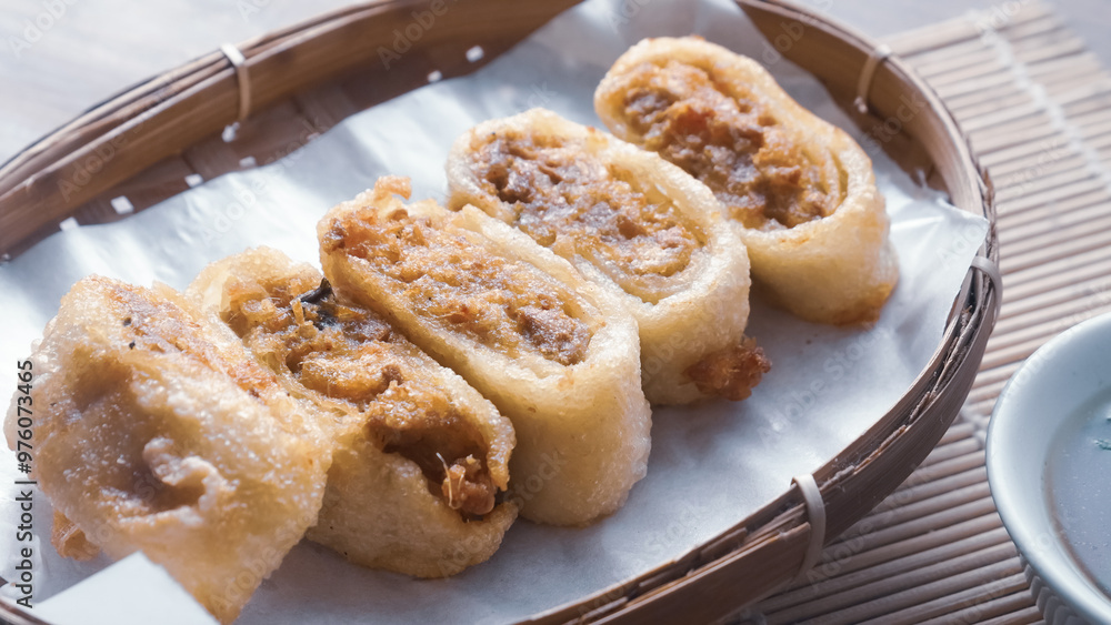 Gohyong is typical chinesse food served with sliced chilies and cuko sauce. Gohyong is typical chinesse food served with sliced chilies and cuko sauce.