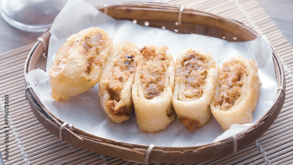Gohyong is typical chinesse food served with sliced chilies and cuko sauce. Gohyong is typical chinesse food served with sliced chilies and cuko sauce.
