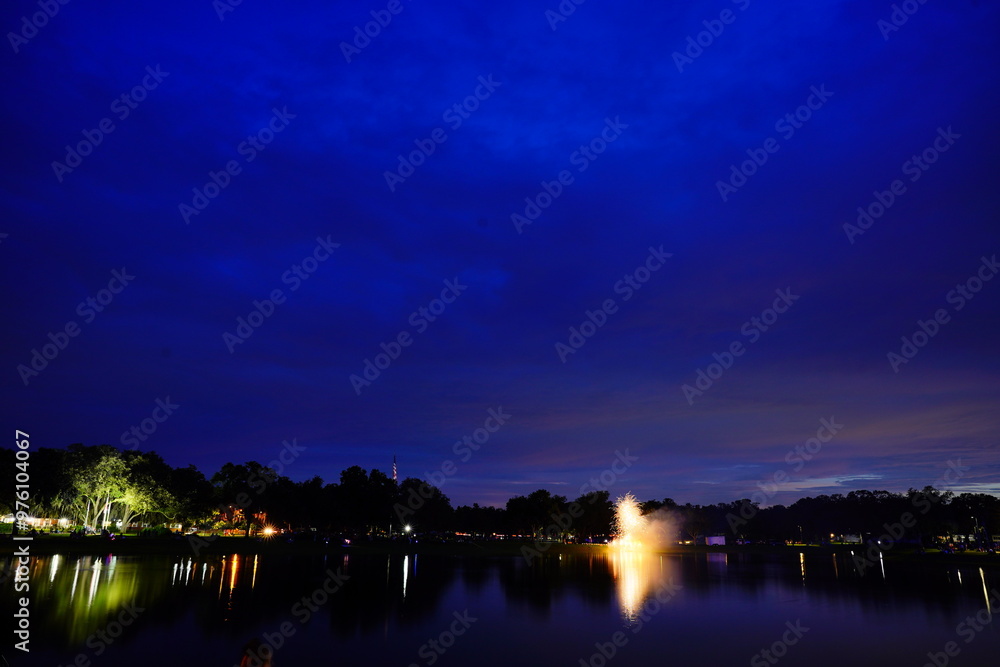 Fototapeta premium Zephyrhills night landscape and water side firework show 
