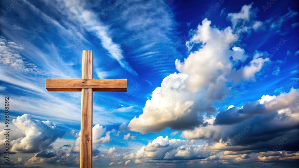 Wooden cross silhouetted against vibrant blue sky with fluffy clouds Wooden cross silhouetted against vibrant blue sky with fluffy clouds